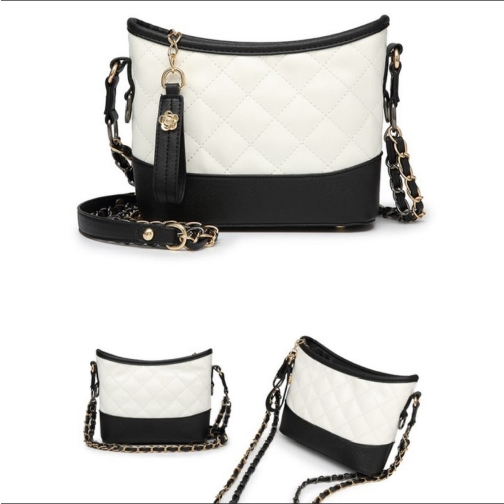 Ivory & Black purse. New in package with tags. Cute little purse for a night out